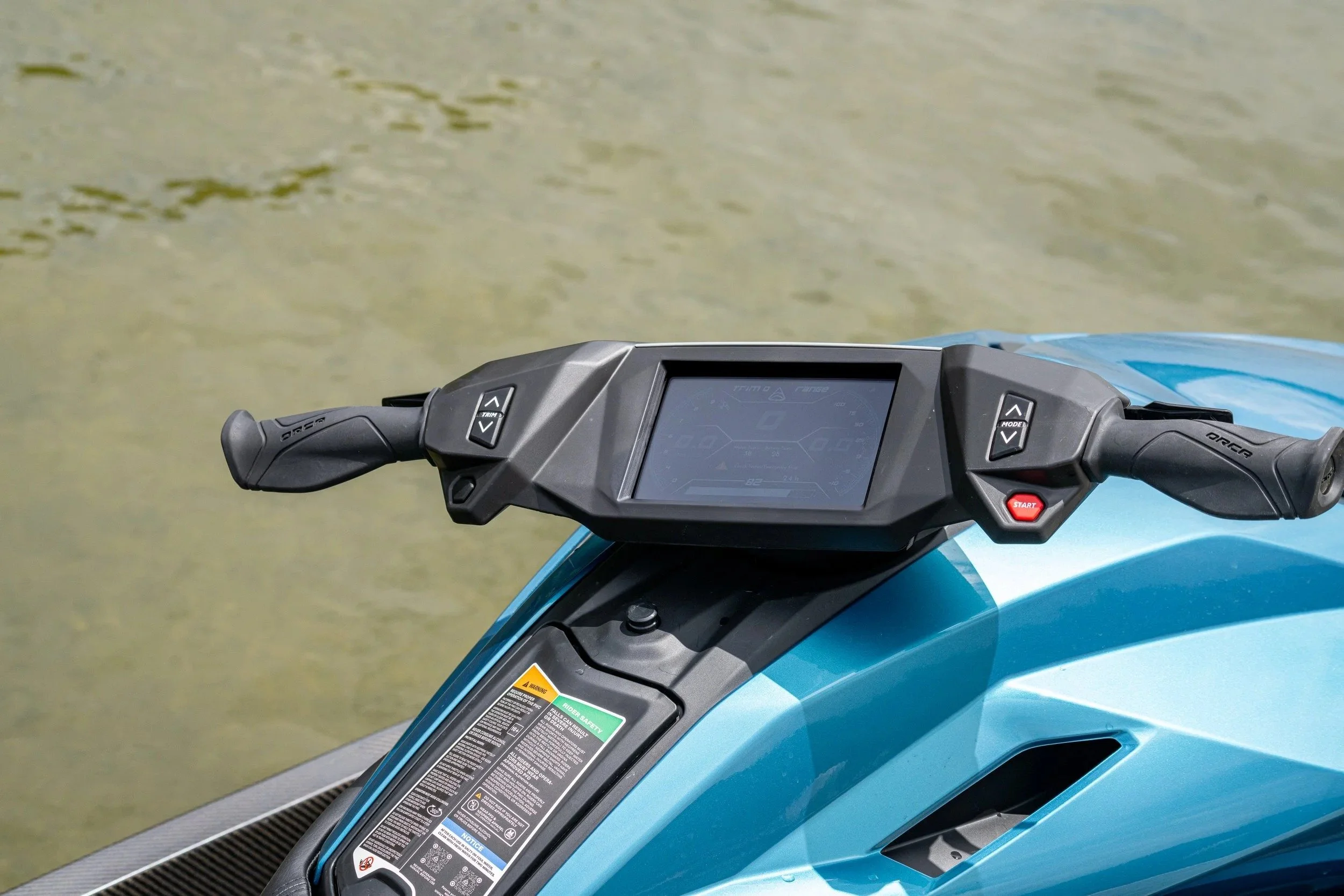 Handlebar and display of a blue Taiga Orca electric personal watercraft