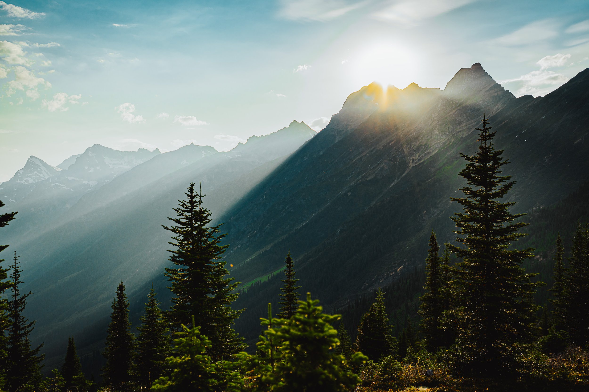 Sun setting behind the peak above the trails, Valemount, BC