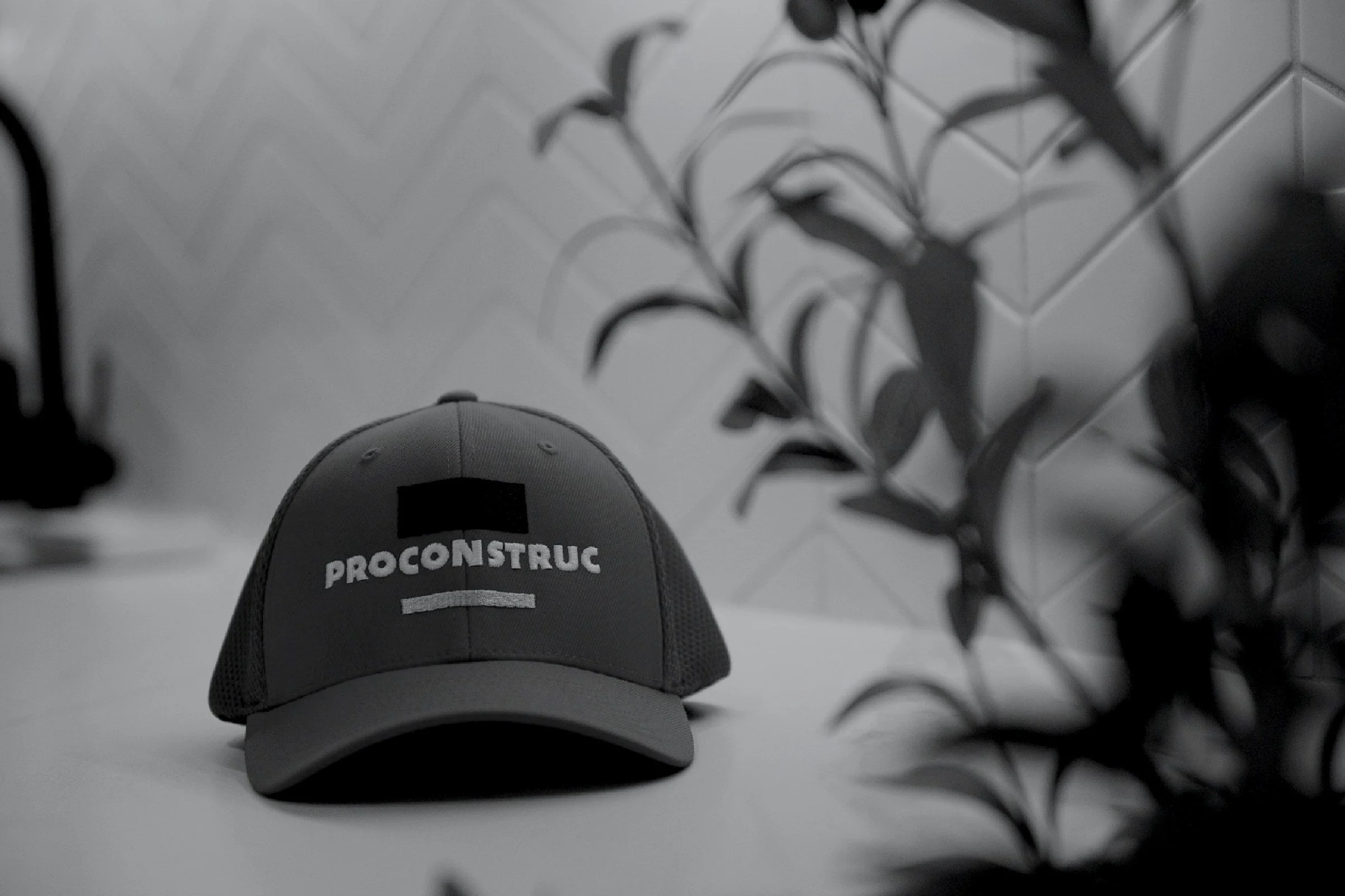 A grey cap embroidered with the ProConstruc logo
