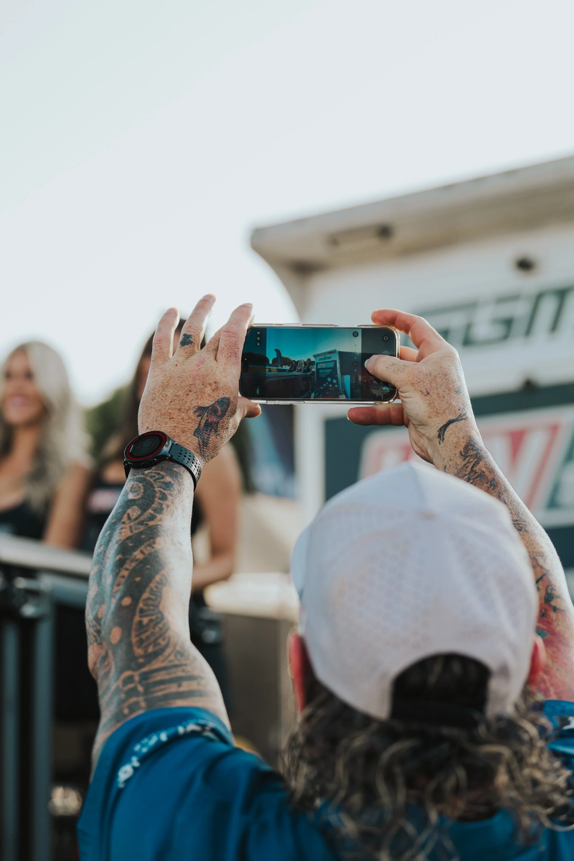 Spectator filming on a phone at the event