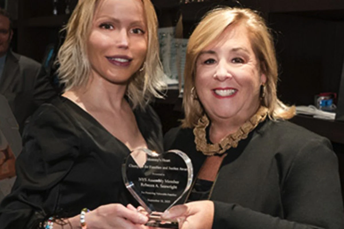 Julianne Michelle presenting an award to Assembly Member Rebecca Seawright