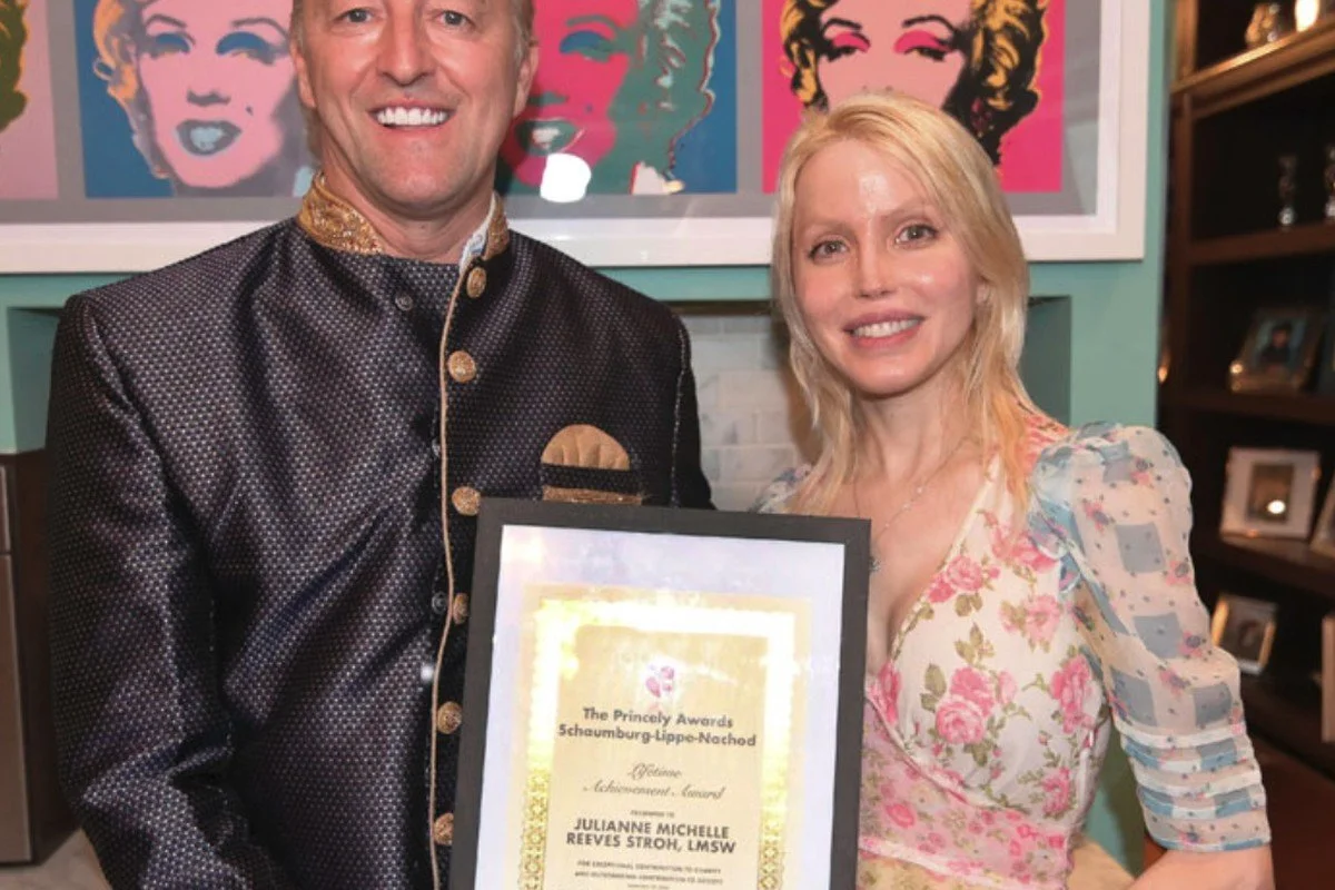 Prince Mario-Max Schaumburg-Lippe presenting Julianne Michelle with a Lifetime Achievement Award