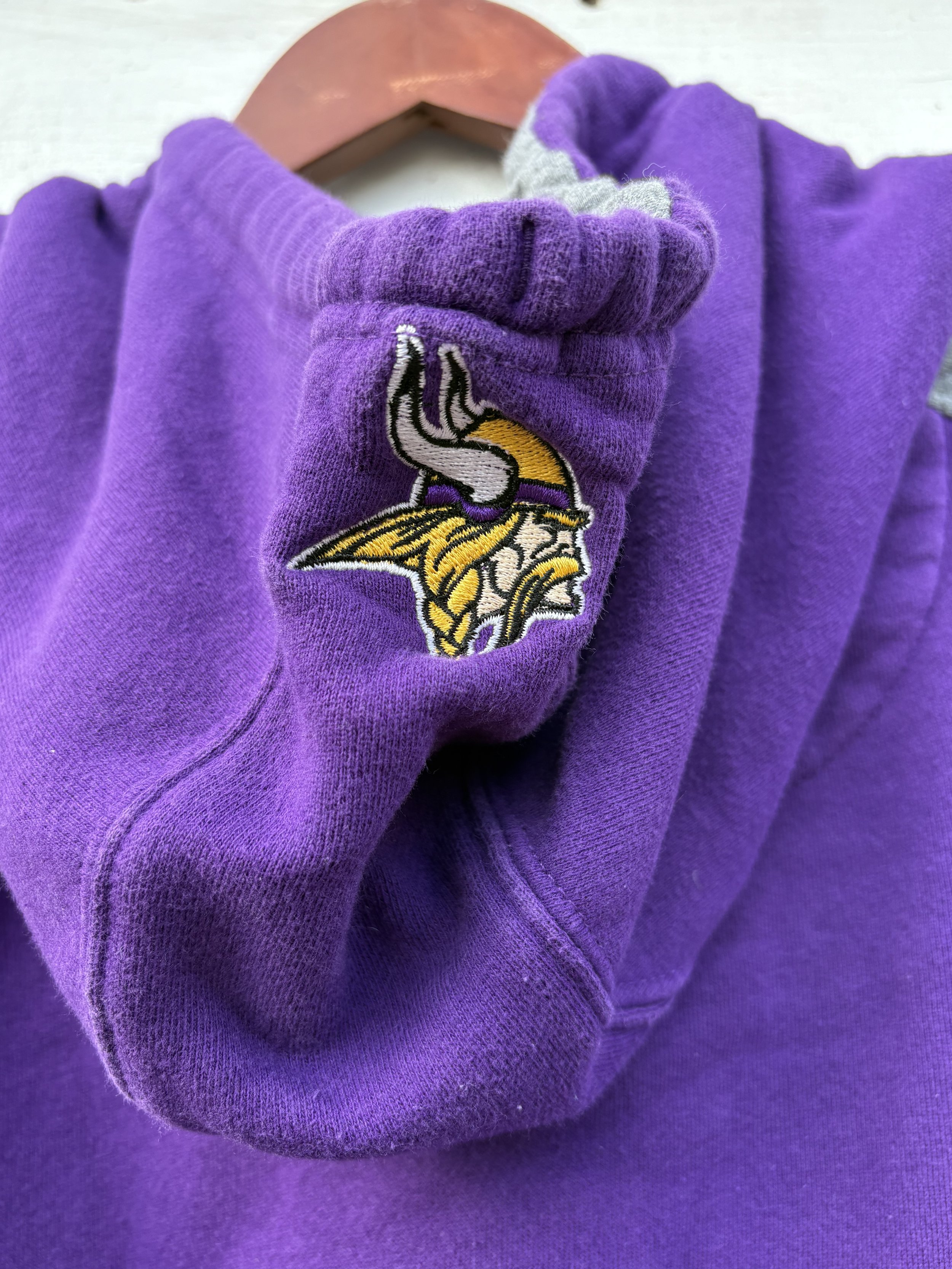 Men's Purple Sweatshirt Close Up logo on hood.jpeg