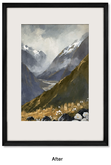 A framed landscape painting of a mountain scene with misty peaks, a valley, and flowers in the foreground.