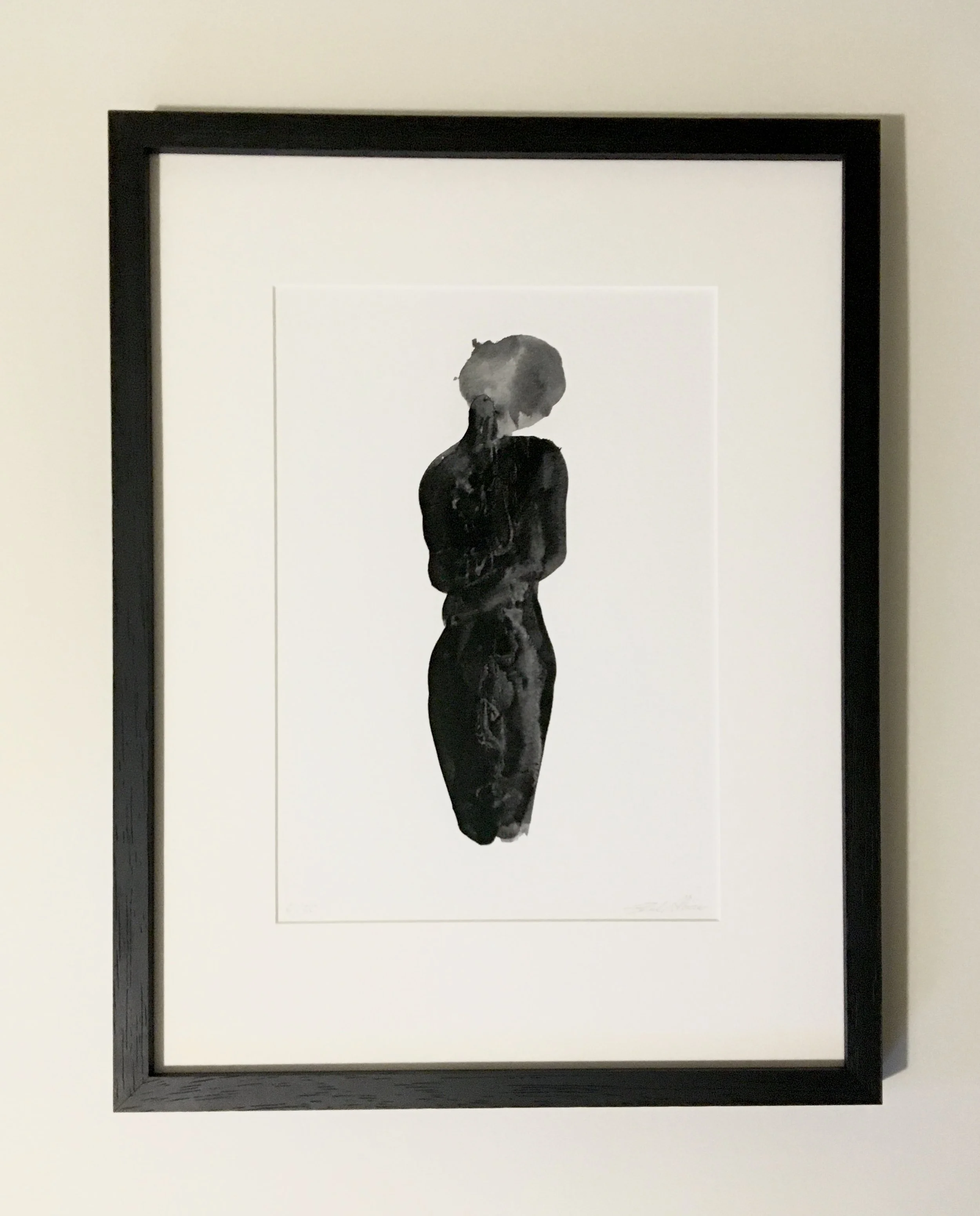 Black and white watercolor painting of a woman with short hair, viewed from the back, framed in black. 'Reality Check' by Sarah Albisser