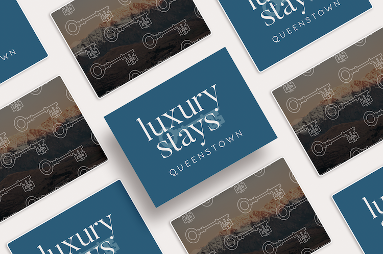 Multiple cards with 'Luxury Stays Queenstown' text and key pattern design, arranged in a scattered pattern. One of the Queentown brand projects that Courtney has designed.