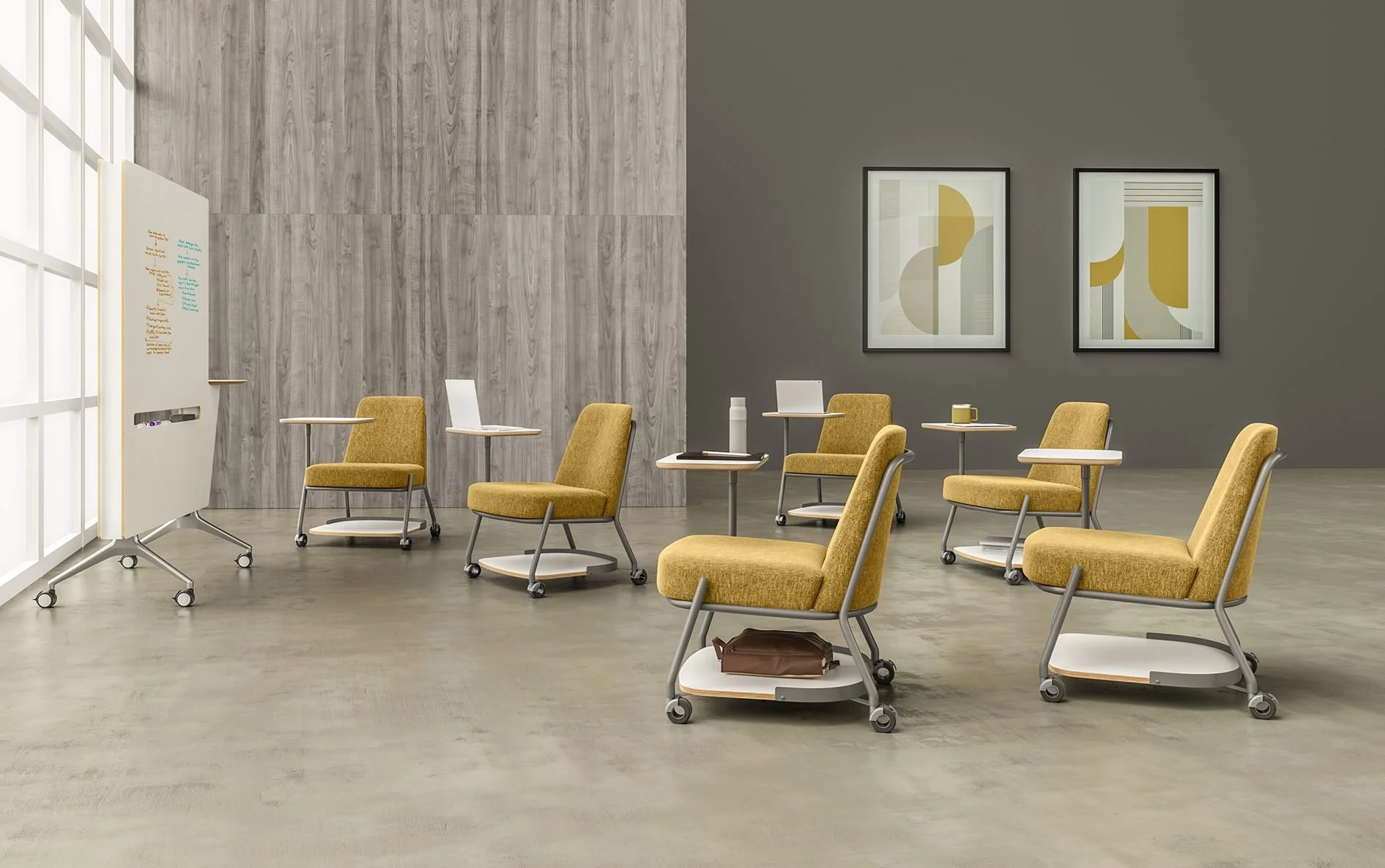 Yellow lounge chairs with tablet arms in a learning space