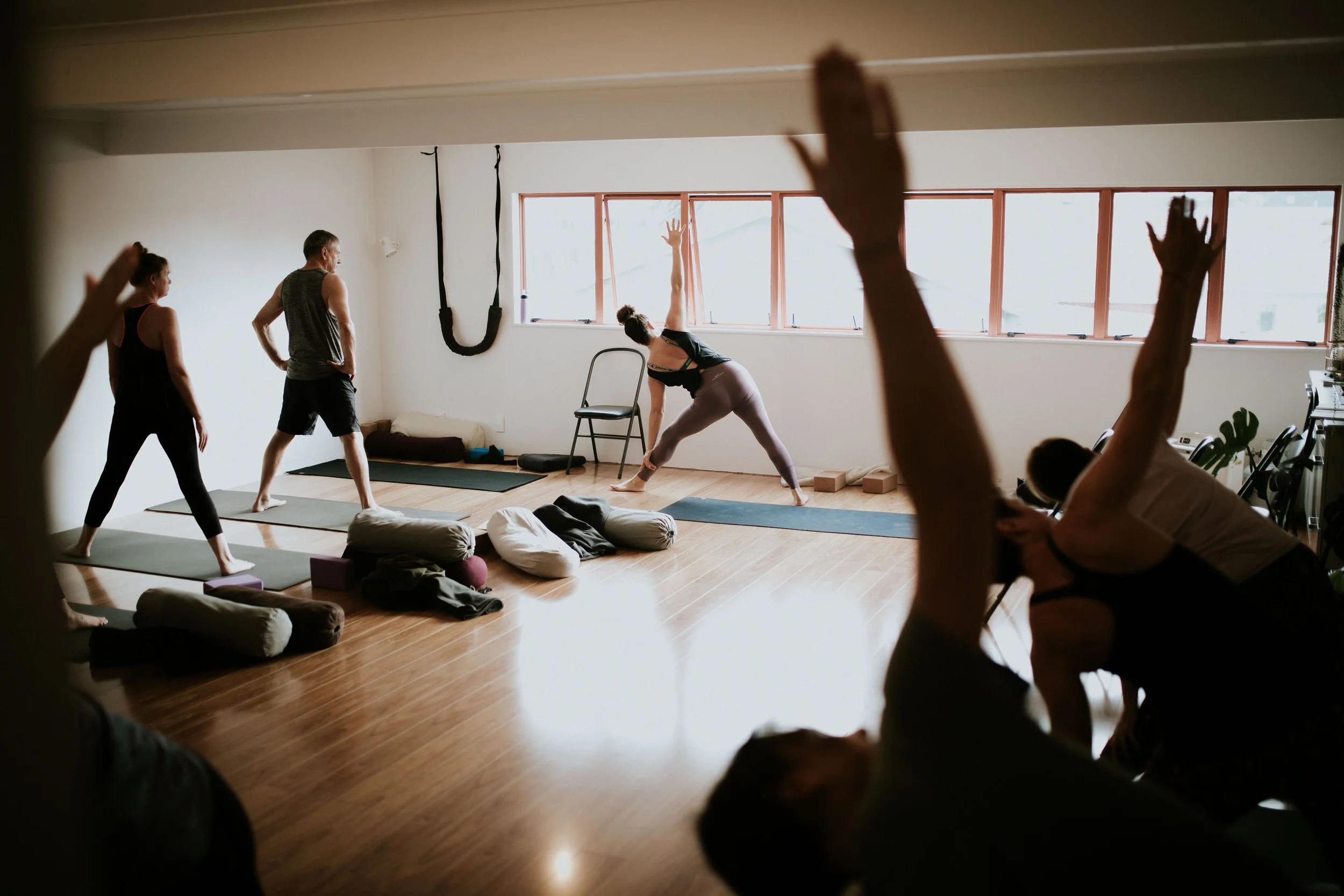 Students practising Iyengar Yoga together at Yoga Whitianga