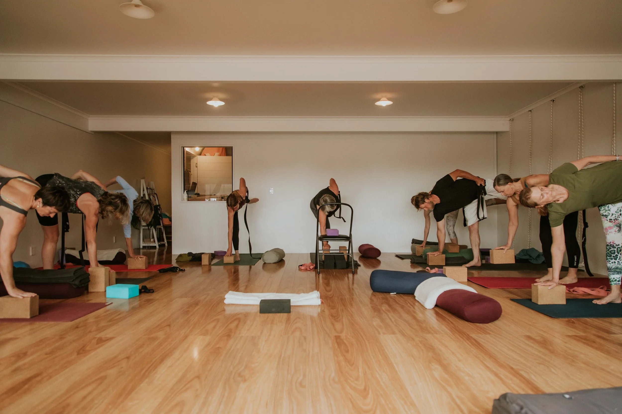 Students practising Iyengar Yoga together at Yoga Whitianga