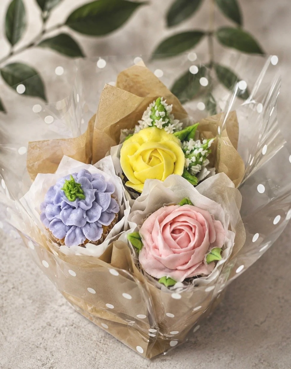 3-Cupcake Bouquet in pink, purple, yellow