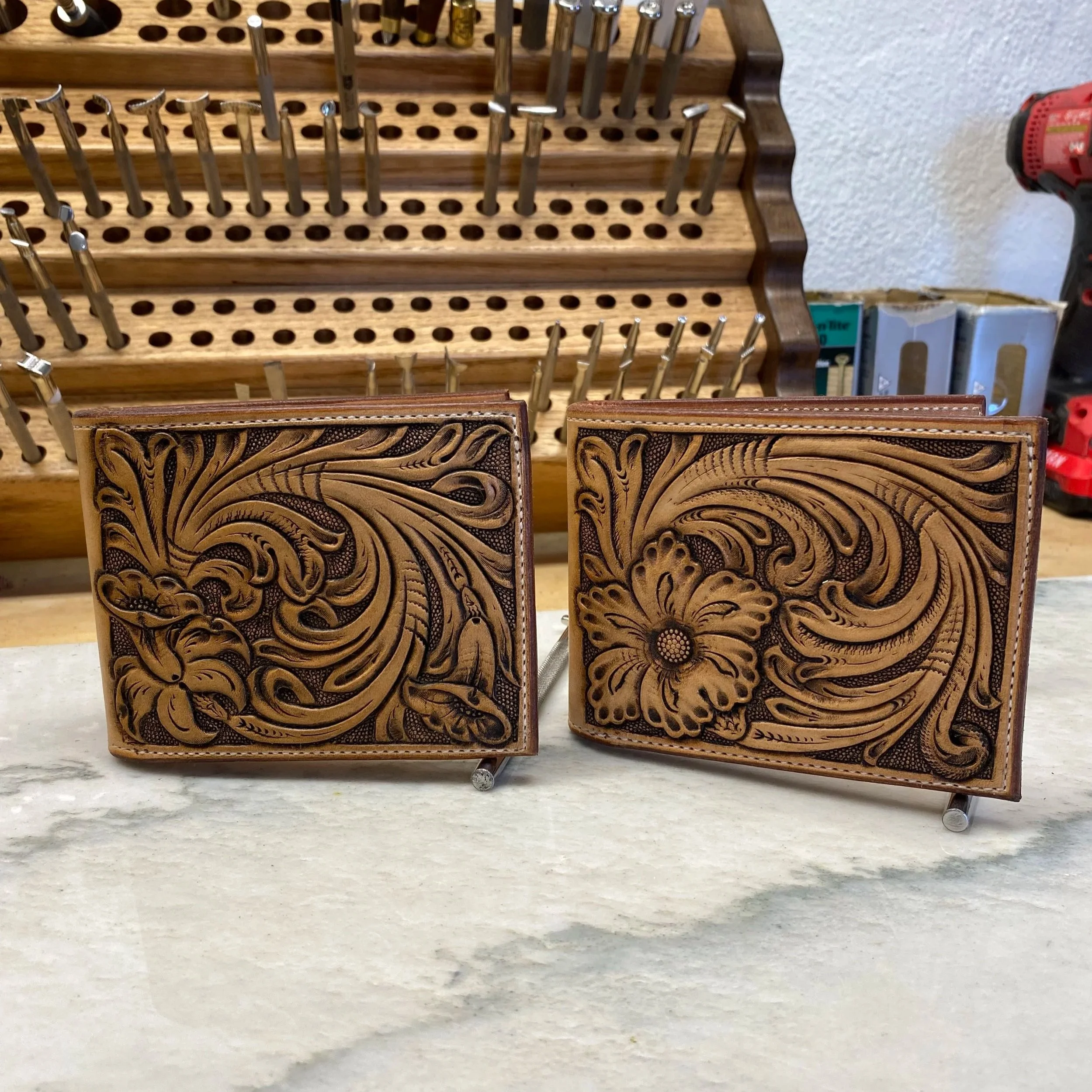 Floral carved leather wallets.
