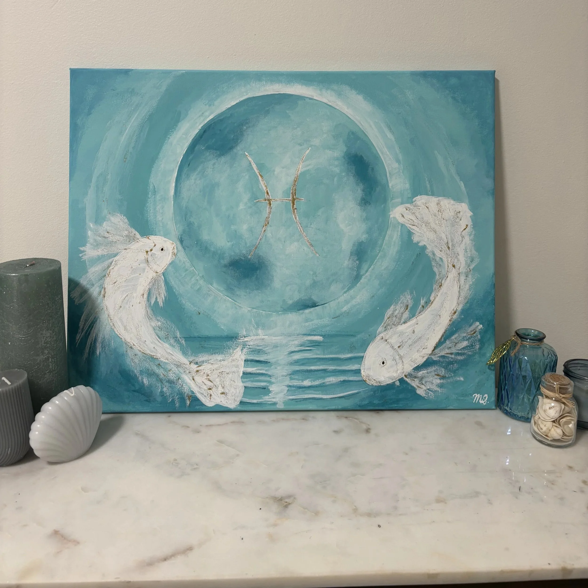 A painting with a turquoise background and abstract white fish with black eyes, featuring two gold-colored lines that resemble an 'X' in the center.