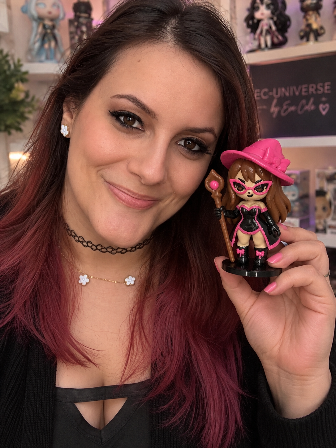 EC-Universe creator and toy designer Eve Cole holding Wondereve, an original collectible character from EC-Universe.