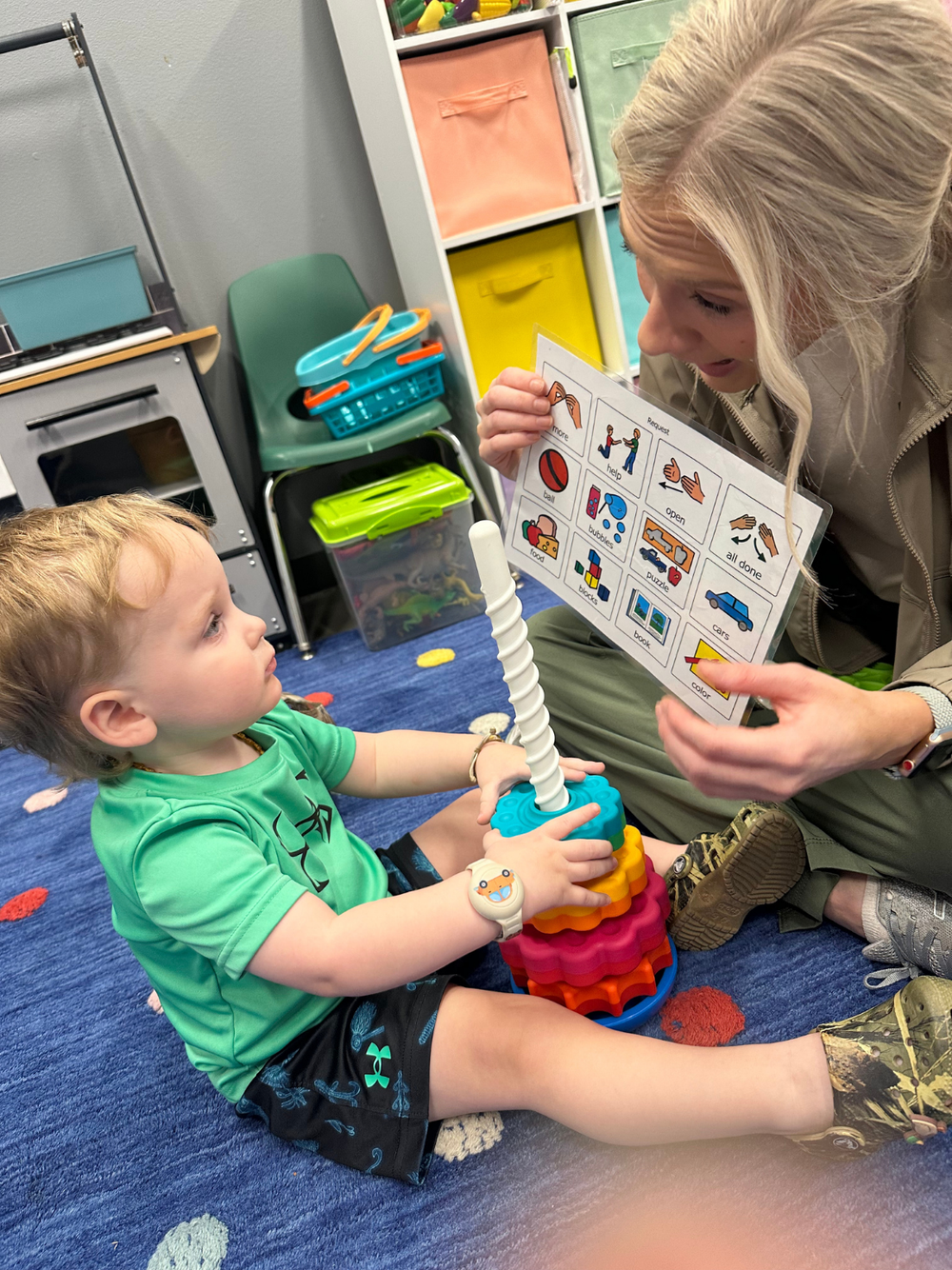 A speech-language pathologist working with a toddler