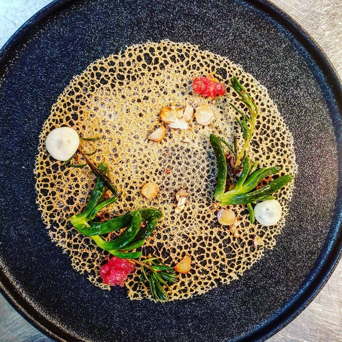 Macadamia tuile with native seablite, native pigface, toasted macadamia, native finger lime and truffle cream.