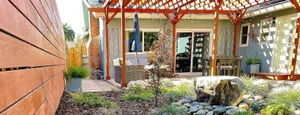 Wooden pergola over a backyard patio