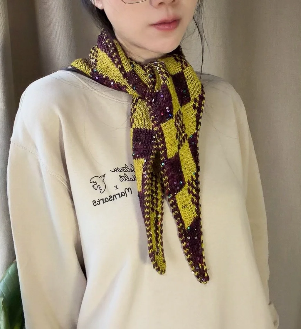 Scarf-centred front detail of Harlequin Gambit tied at the neck