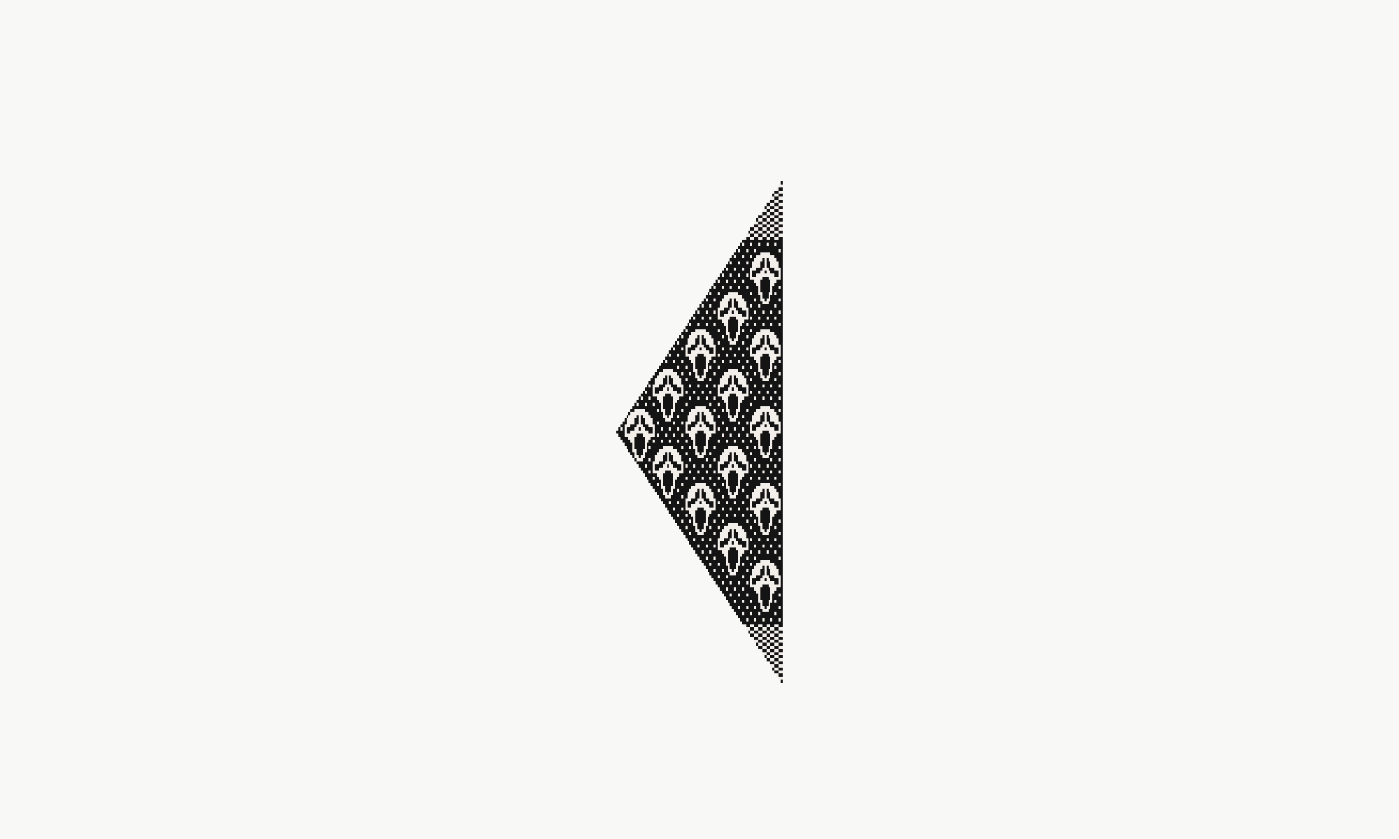 Full face-motif graphic, not a knitted sample