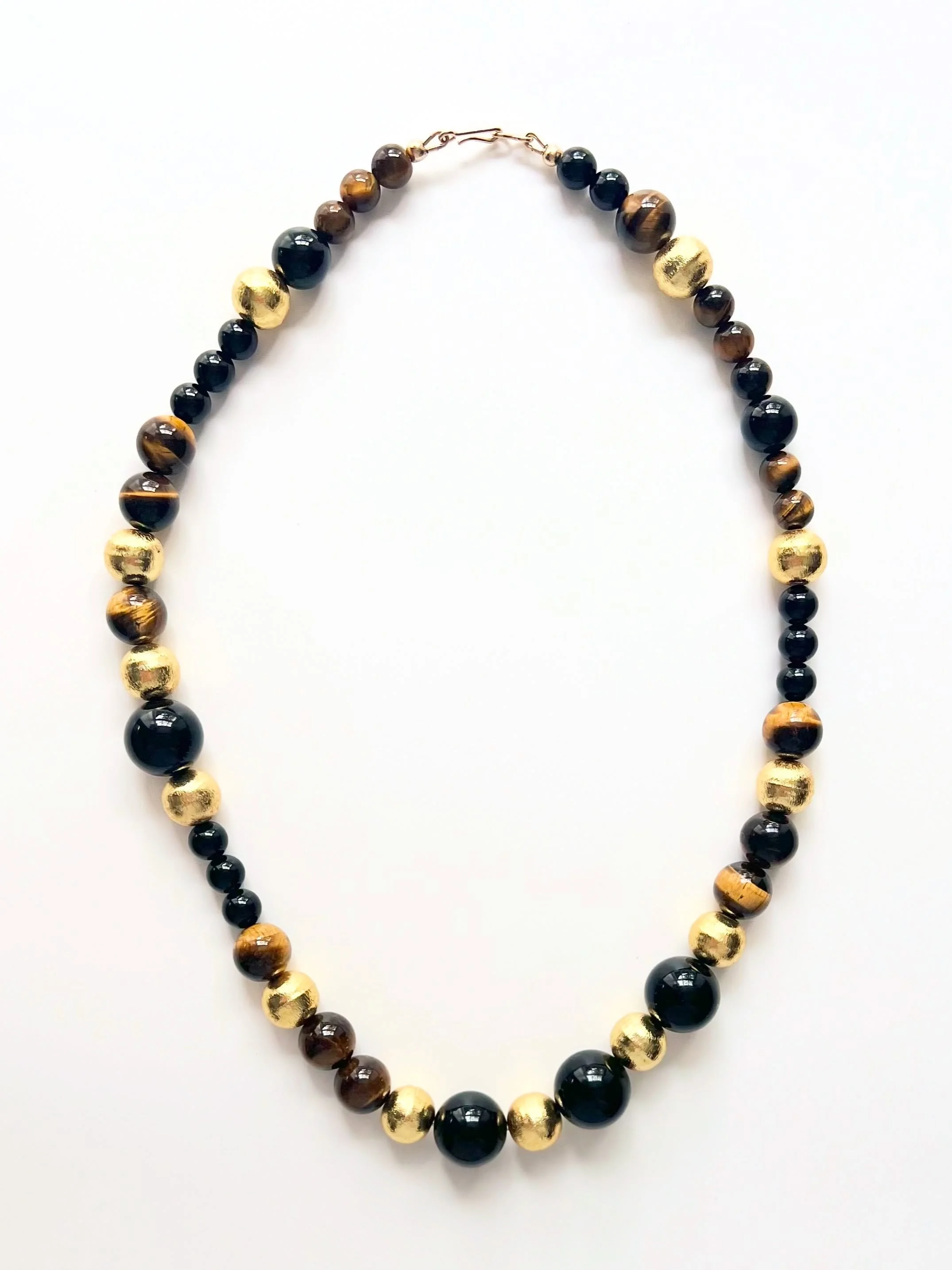 -The only beaded necklace you need this AW season ✨🖤🤎
-Mixed bead sizing, Tiger Eye, Onyx &amp; Gold made with in a generous 20 inch length &amp; as always finished with a gold filled clasp 💫

Jewellery - jewelry - handmade - fashion - necklace - 