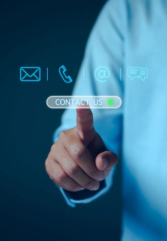 Person in a blue shirt touching virtual contact icons, including email, phone, and chat, with a 'Contact Us' button highlighted.