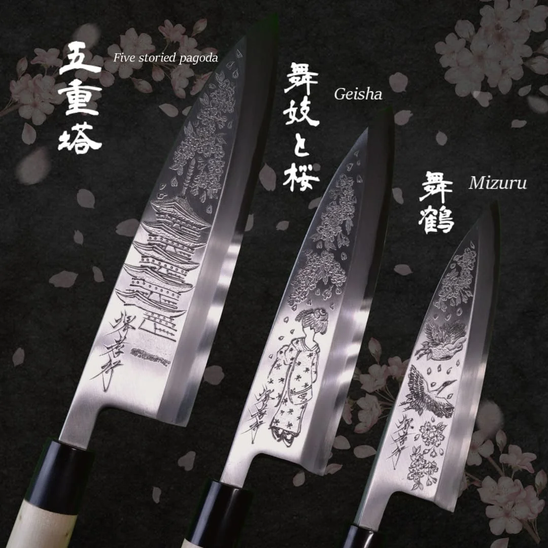 Three Japanese kitchen knives with engraved designs, labeled as Five Storied Pagoda, Geisha, and Mizuru, against a dark background with cherry blossom petals.