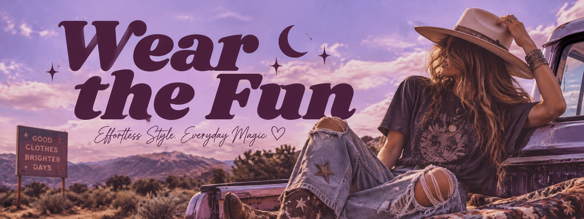 A woman with long red hair wearing a beige hat, ripped jeans with star patches, and a dark graphic t-shirt, sitting on the hood of a vintage truck in a desert landscape at sunset. The sky is purple and pink, with mountains in the background. A sign reads 'Good Clothes Brighter Days'. Large, playful text says 'Wear the Fun' with smaller cursive text 'Effortless Style. Everyday Magic.'