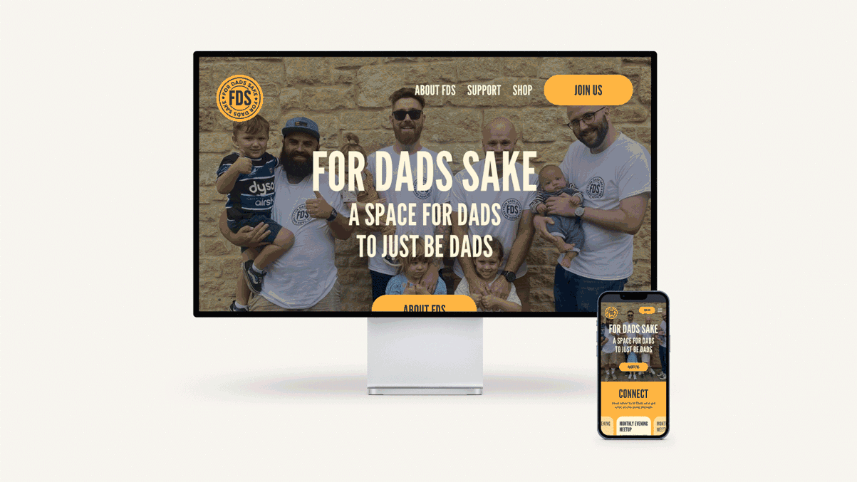 A website homepage displayed on a computer monitor and a smartphone screen, promoting an organization called For Dads Sake with a photo of a group of men and children, featuring the organization's logo and navigation menu.