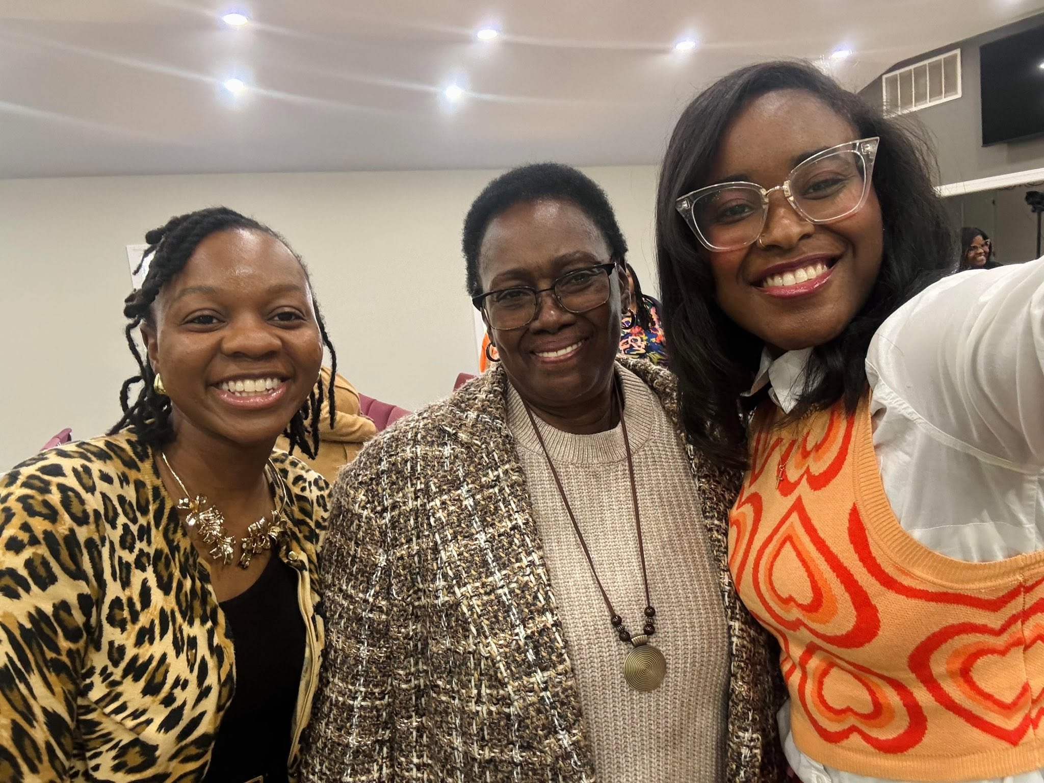 Group of four smiling women taking a selfie at Lion of Judah Community Church