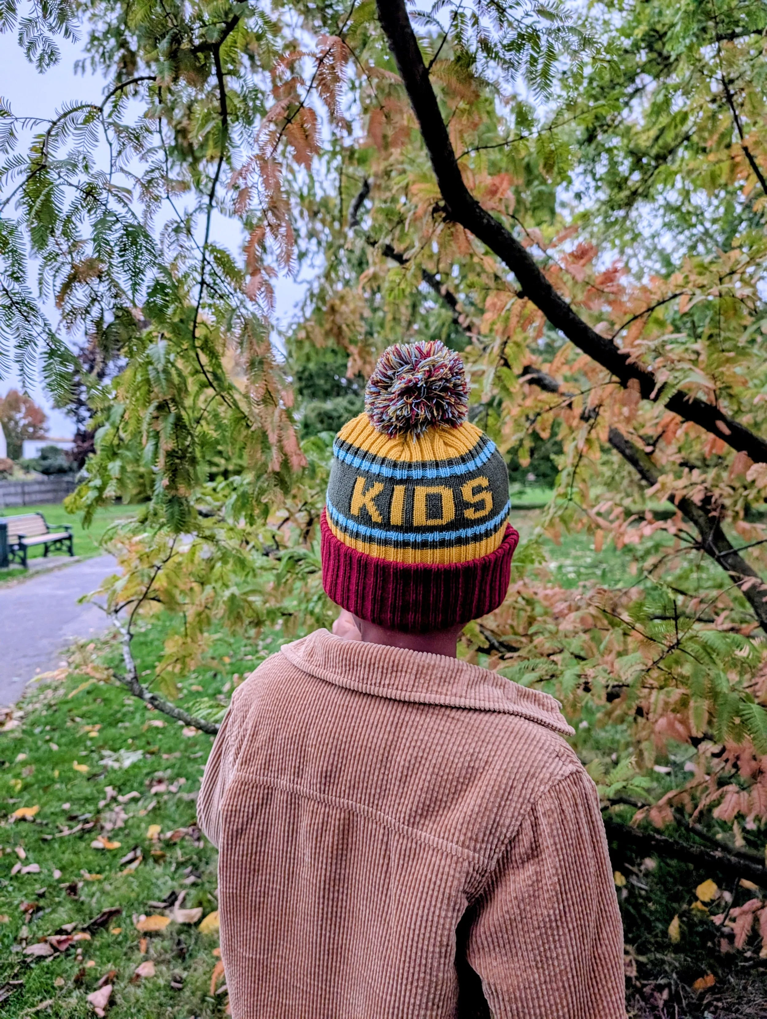 Young boy wearing memory shield beanie outdoor in the park
