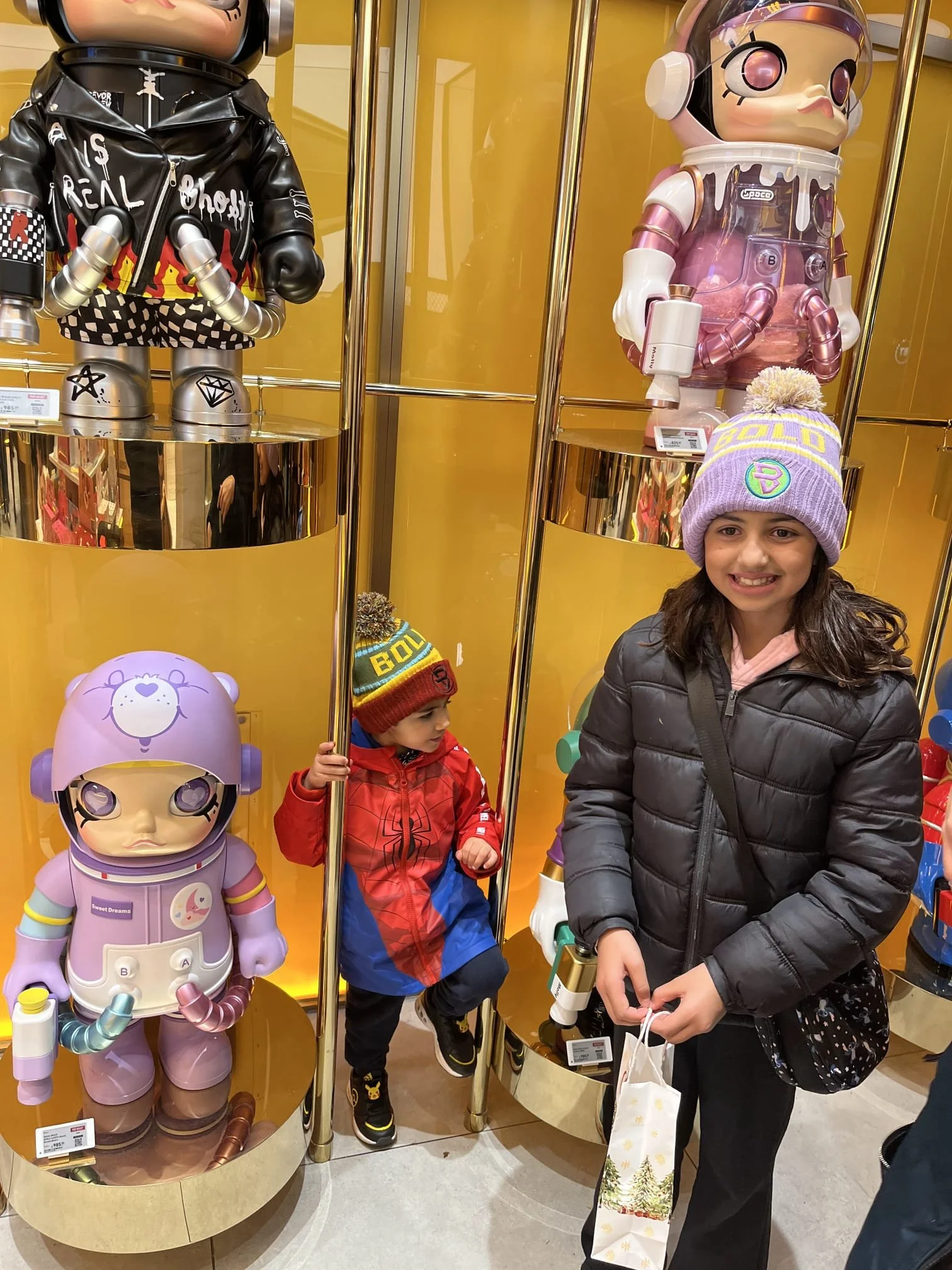 Brother and sister out in london wearing the bold kidswear beanie