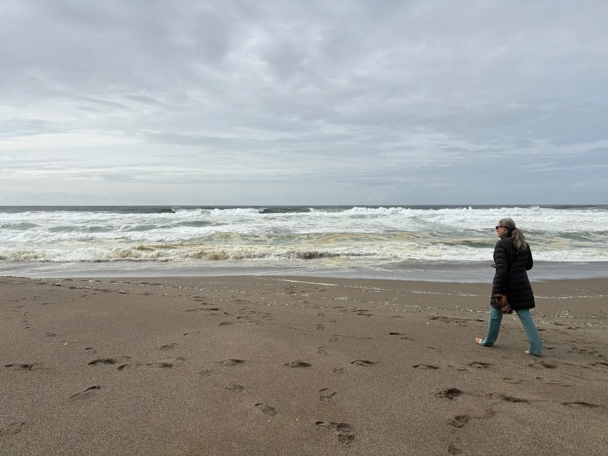 Tamara Walker walking on beach