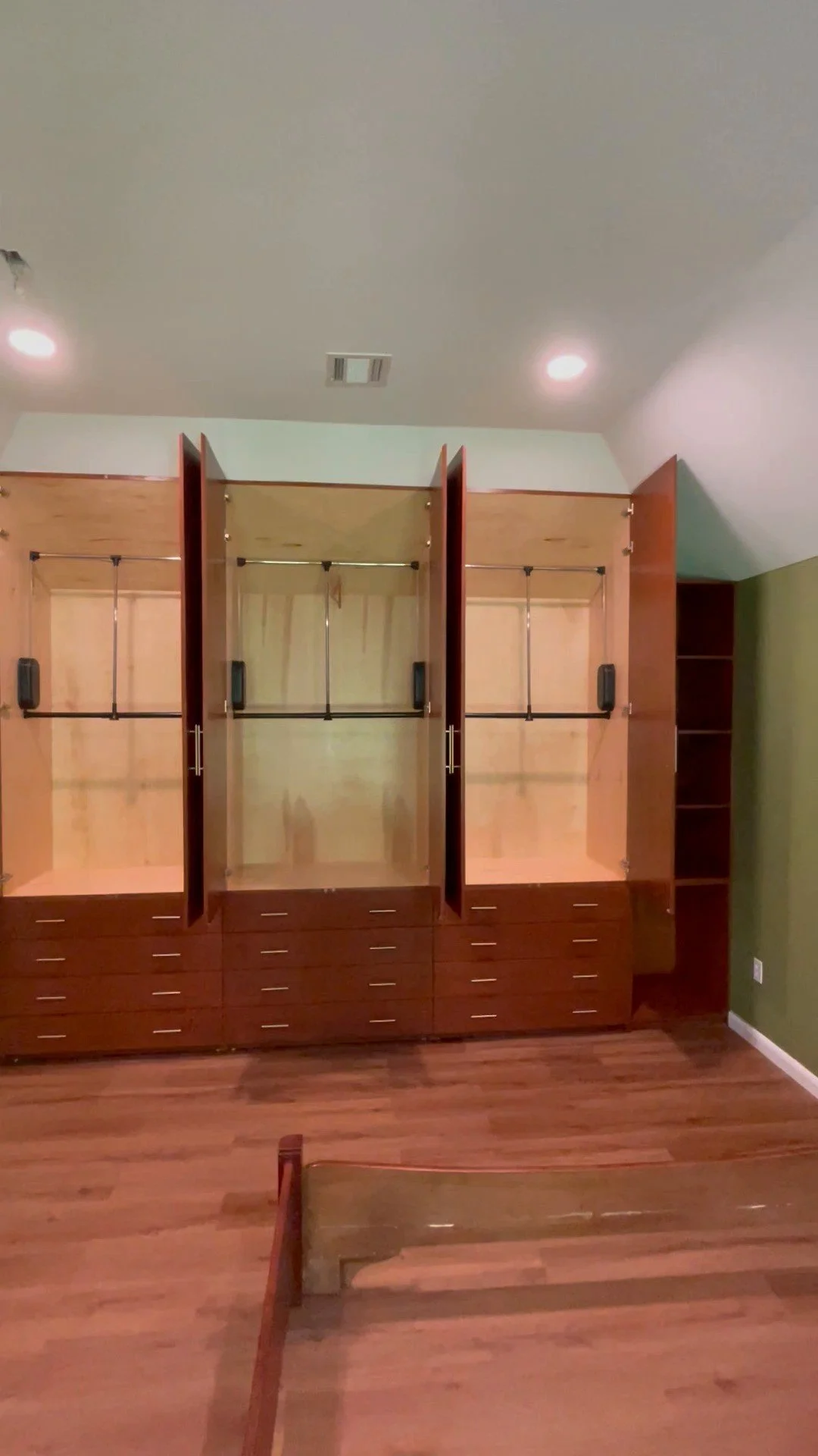 Cherry wall-to-wall closet unit in a vaulted bedroom, Denville, NJ.