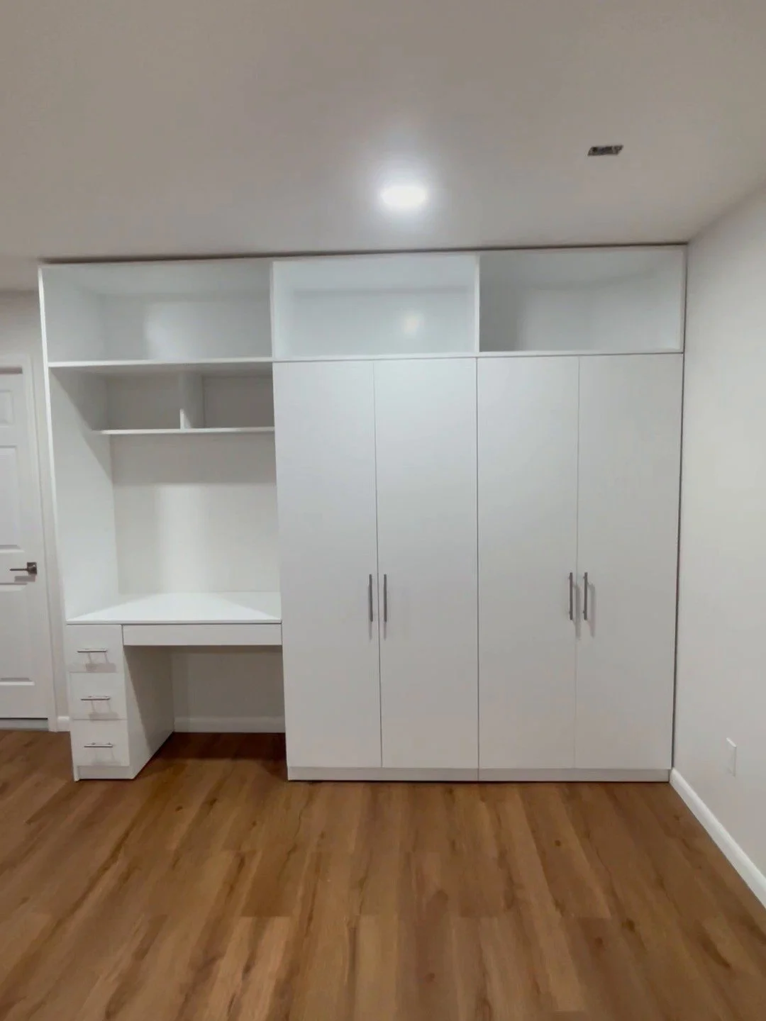 Custom white closet wall unit with built-in desk, Morris County NJ