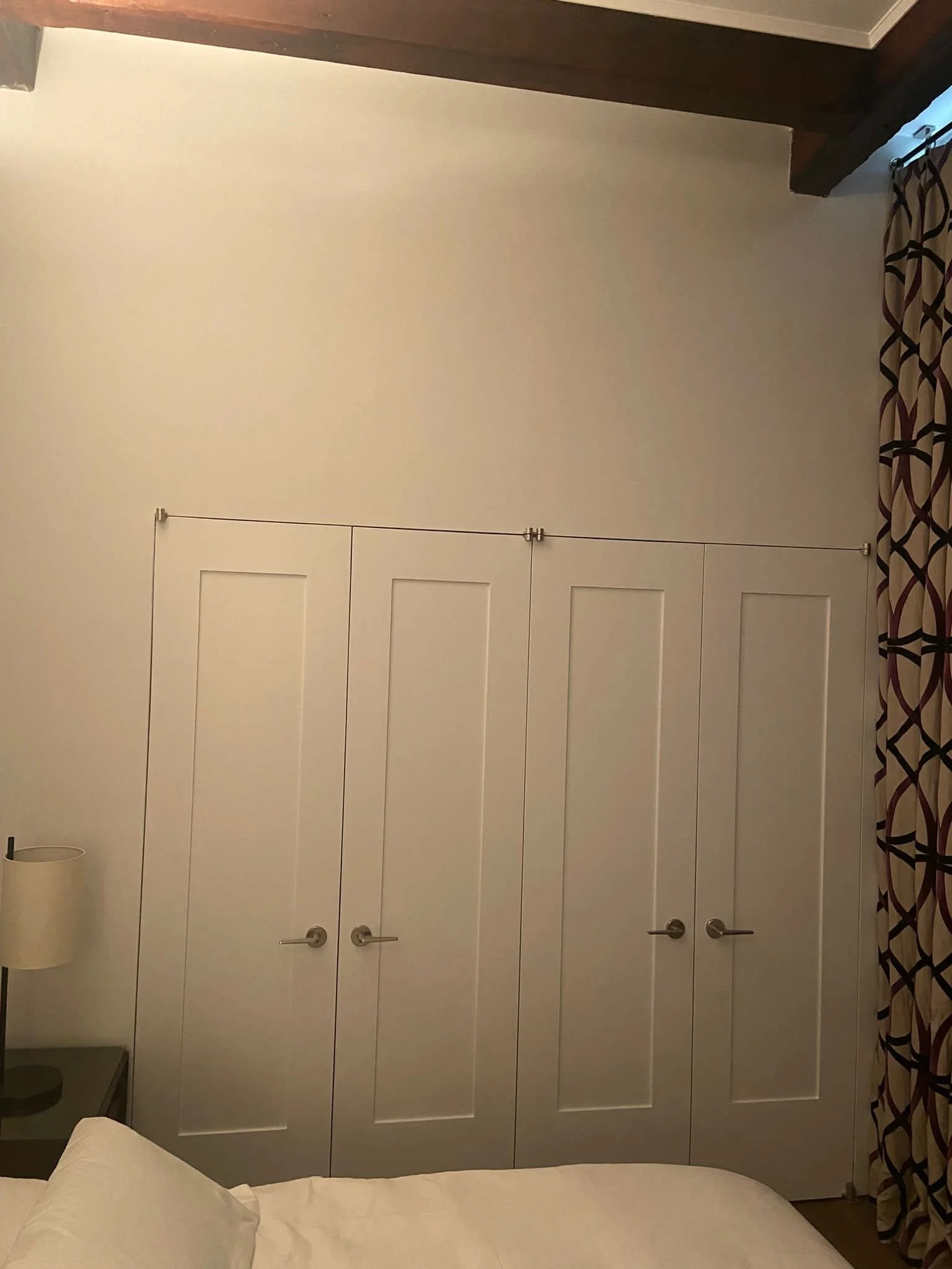 Custom white shaker-style closet doors with brushed-nickel pulls, Denville, NJ.