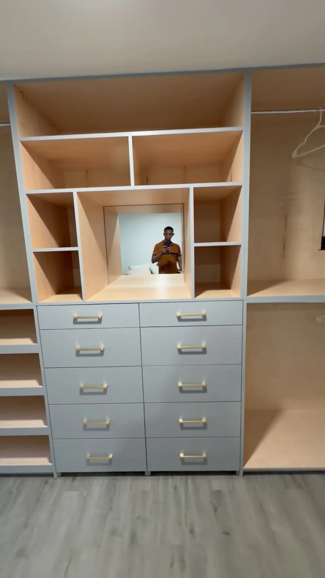 Custom bedroom closet unit with lighted mirror and drawer bank, Mount Olive, NJ.