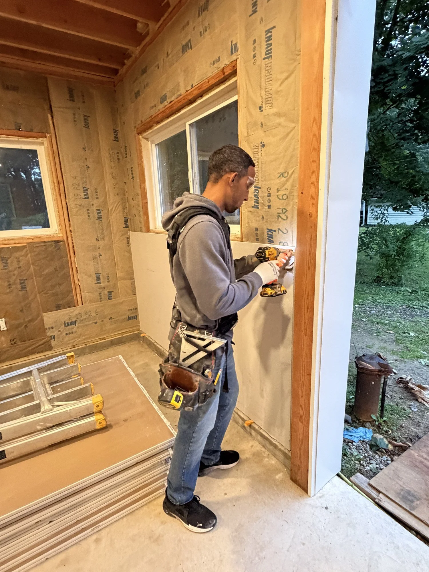 Rigoberto Martinez installing drywall on a home renovation in Morris County, NJ