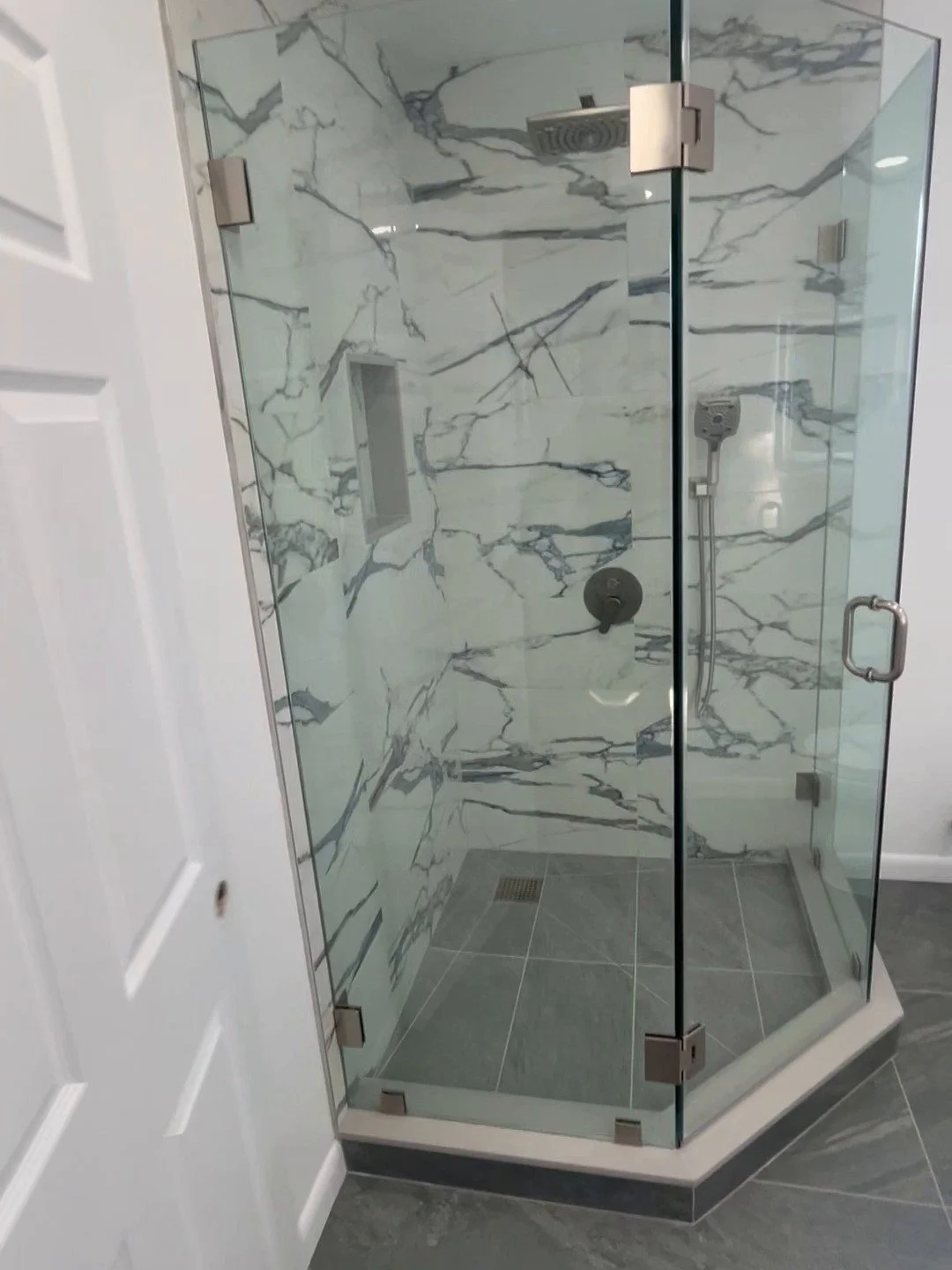 Bathroom remodel with glass corner shower and porcelain tile by Magic Solutions Construction, NJ