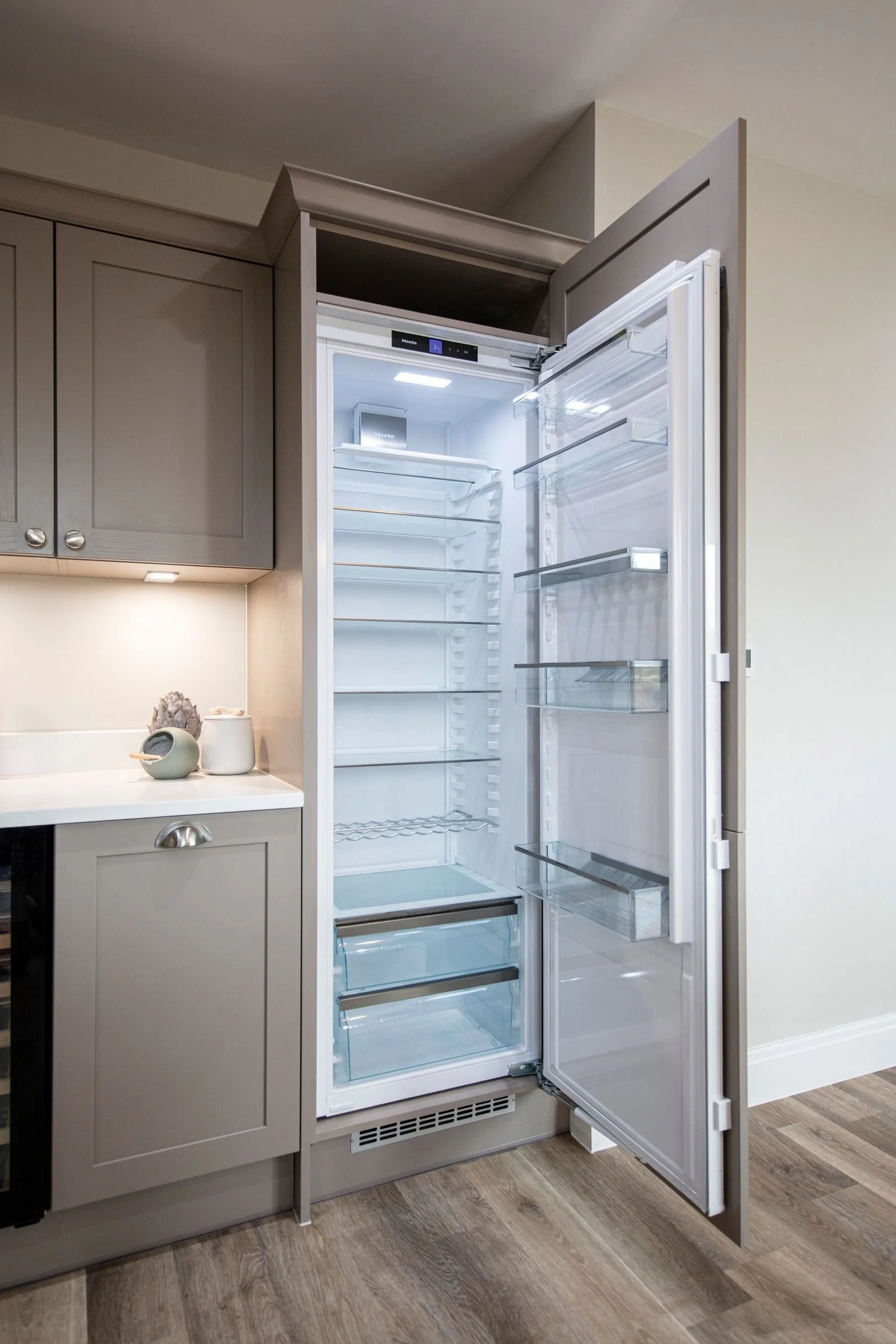 Integrated Miele larder fridge and freezer.
