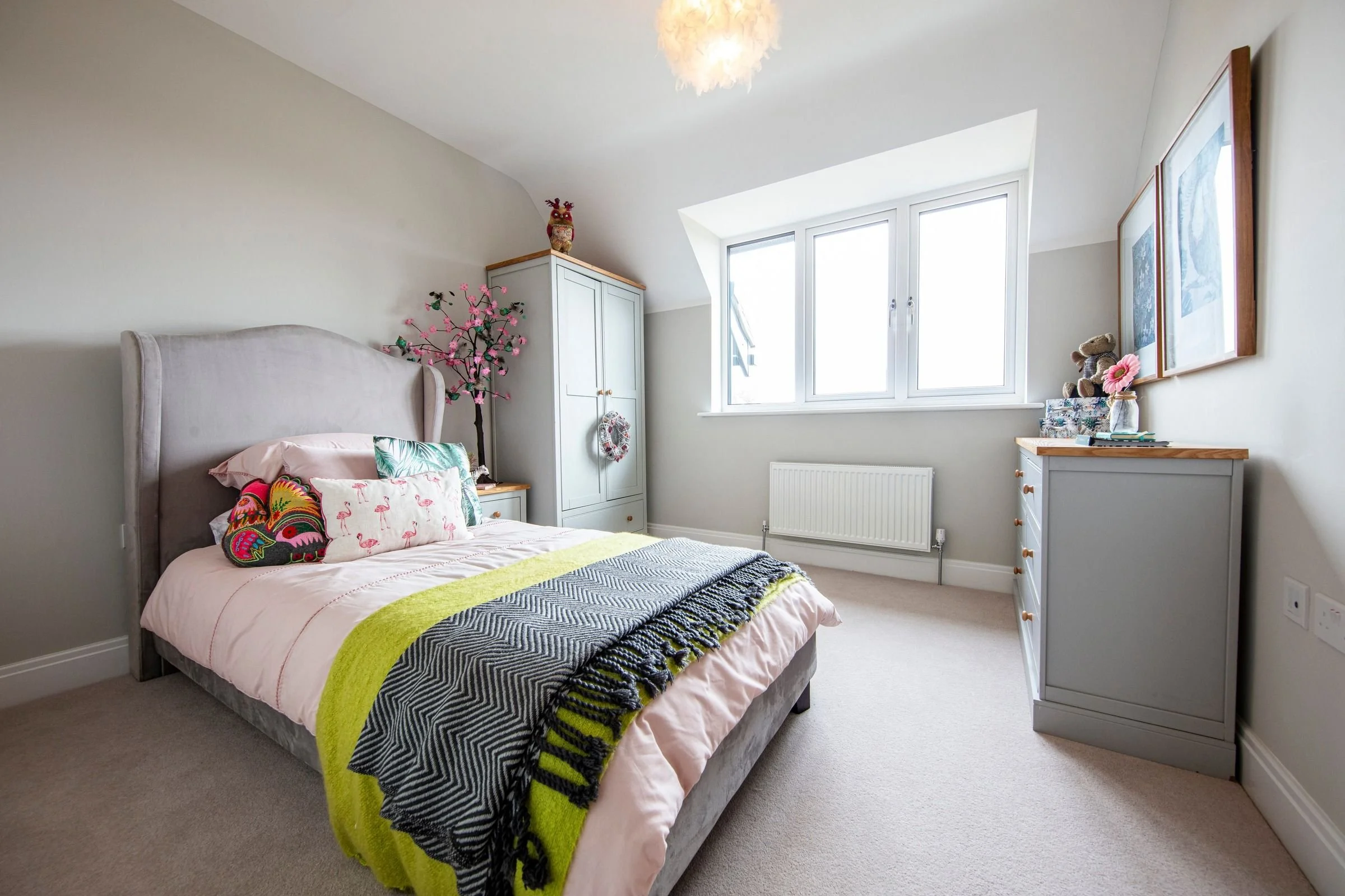 Bedroom 4 with a wide window and fitted carpet.