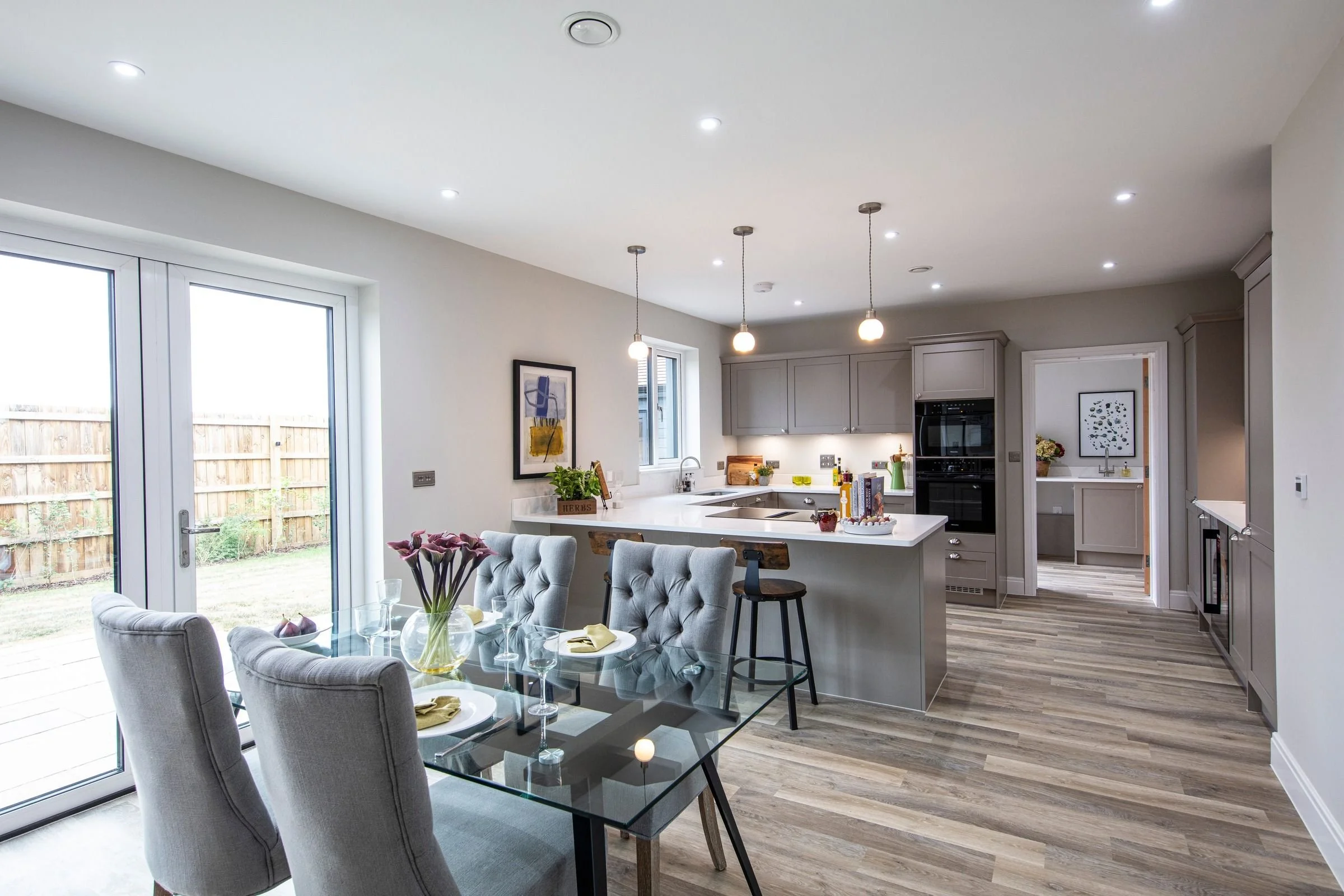 Dining area beside the kitchen with bifold doors to the garden.