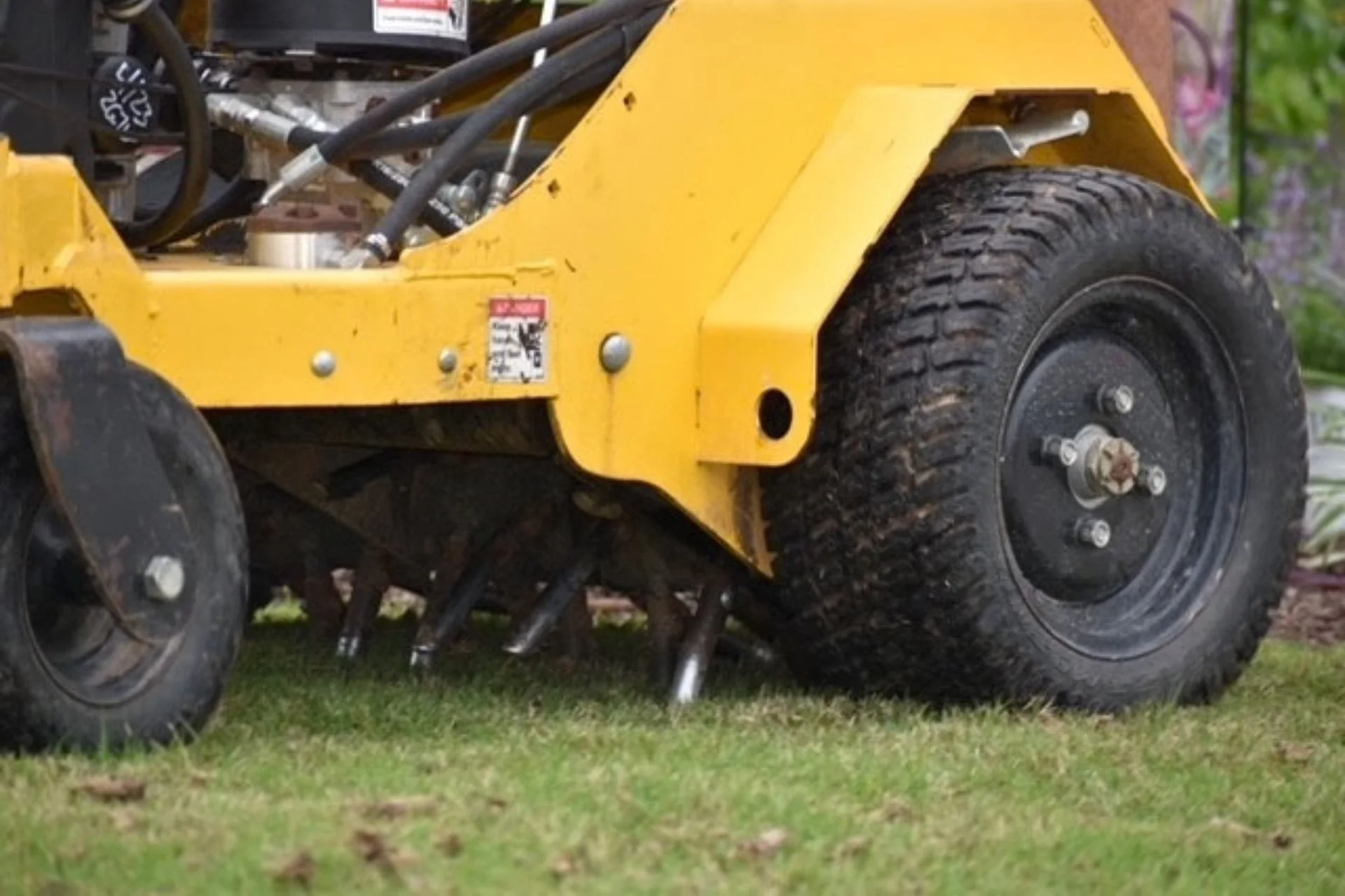 Core aerator equipment on a residential lawn in Wilmington, NC