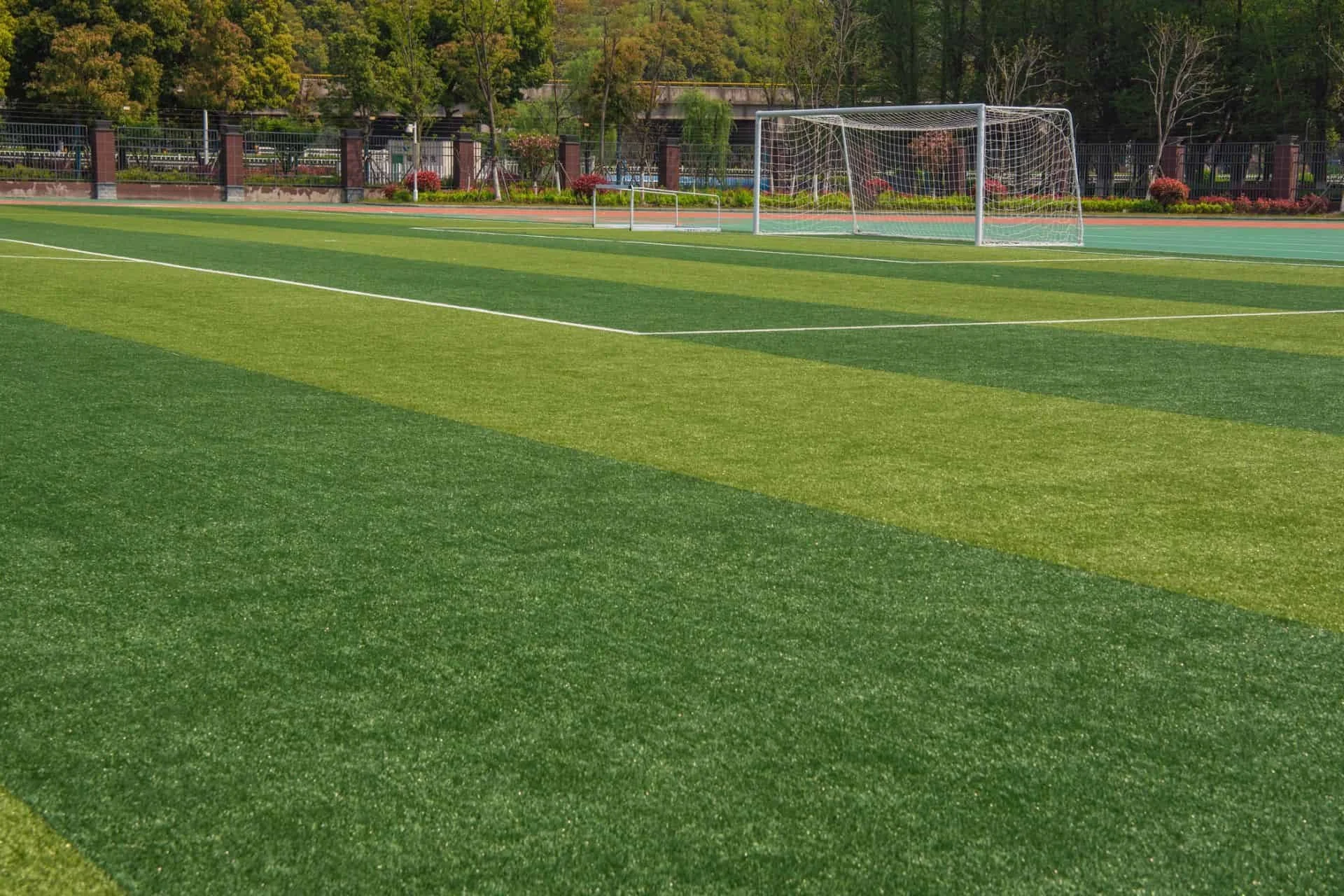 Marked soccer field with a goal and tree line at an athletic facility in Wilmington, NC