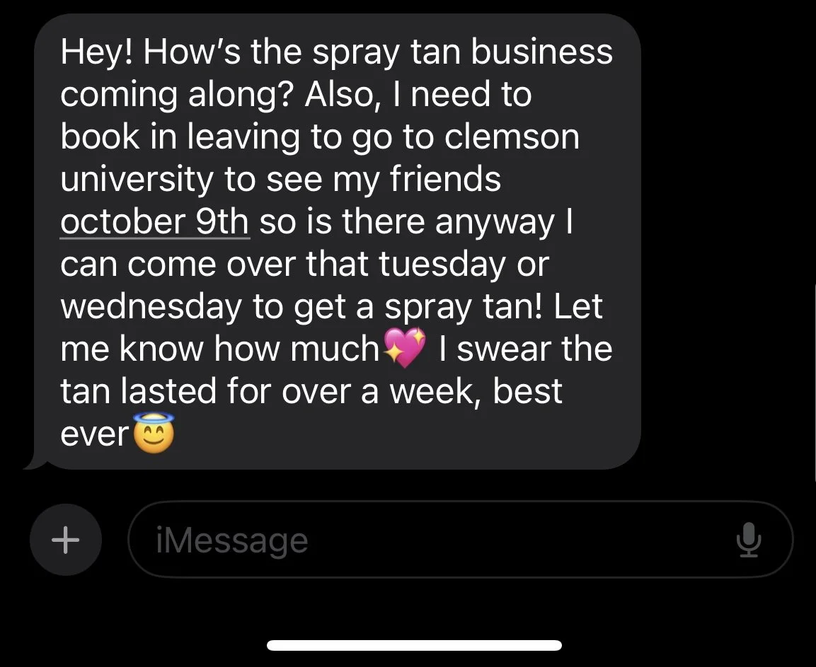 A screenshot of a text message conversation about getting a spray tan, with emojis of a pink heart, a halo, and a smiling face.