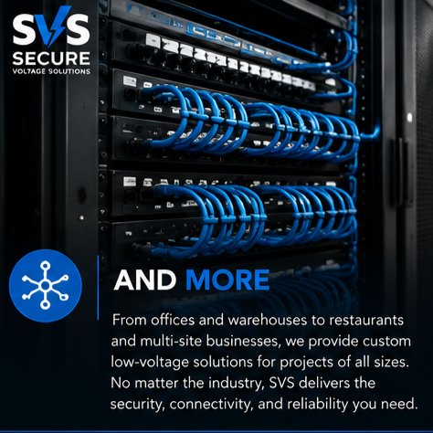 Close-up of a server rack with multiple rows of blue Ethernet cables connected to network switches or patch panels.