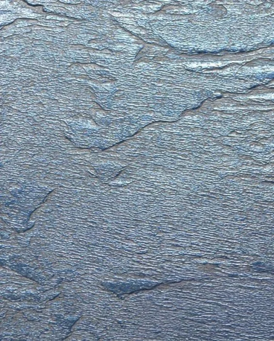 Surface rocheuse avec des fissures et des textures rugueuses.