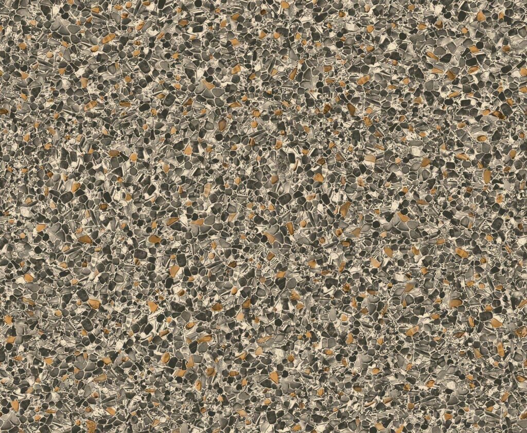 Surface en pierre avec un motif de petits cailloux noirs, gris et beige.