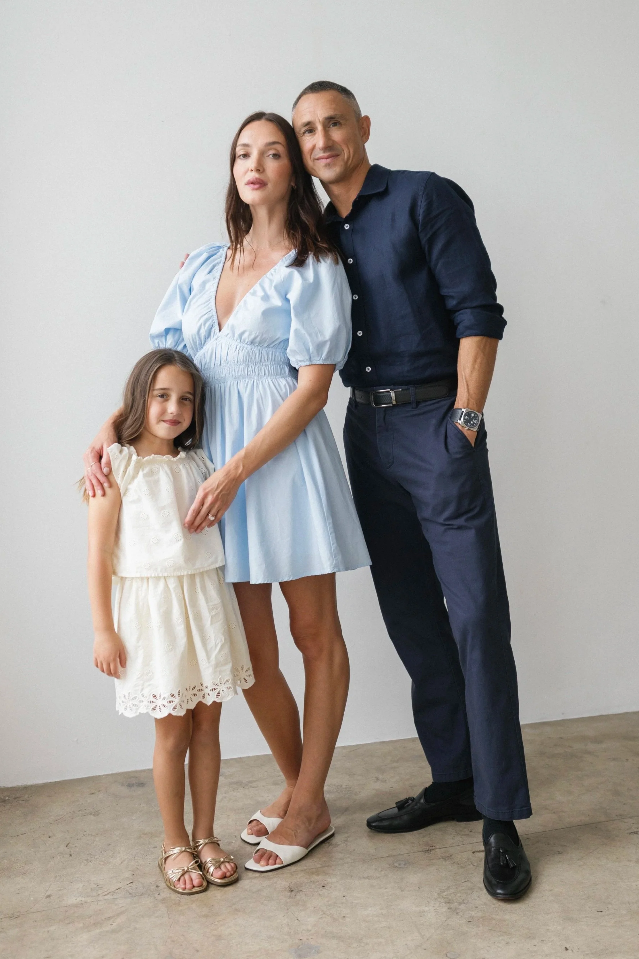 Julia, Rob and their daughter in a family lifestyle portrait.