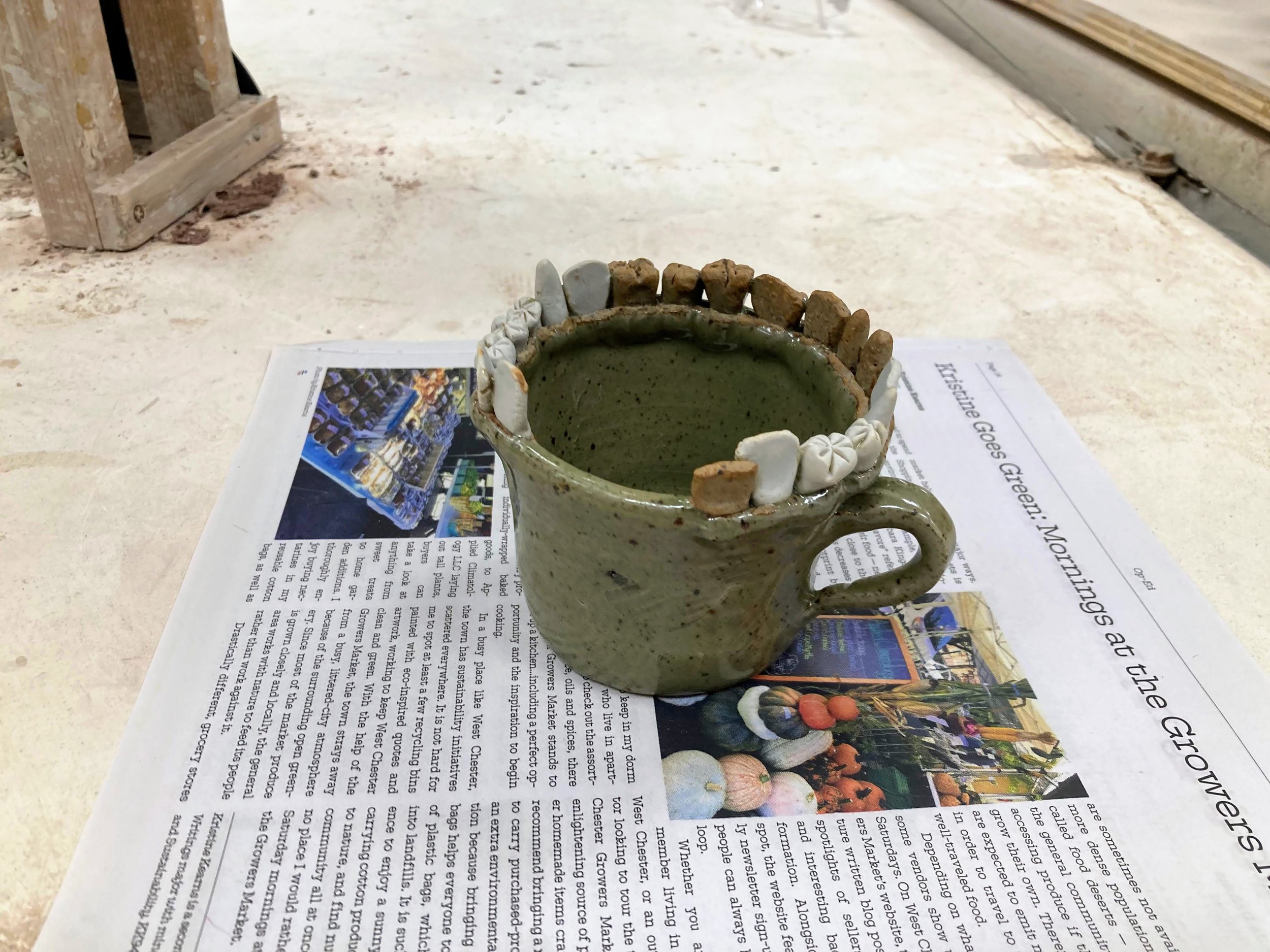 Stoneware mug with stoneware and porcelain teeth accents