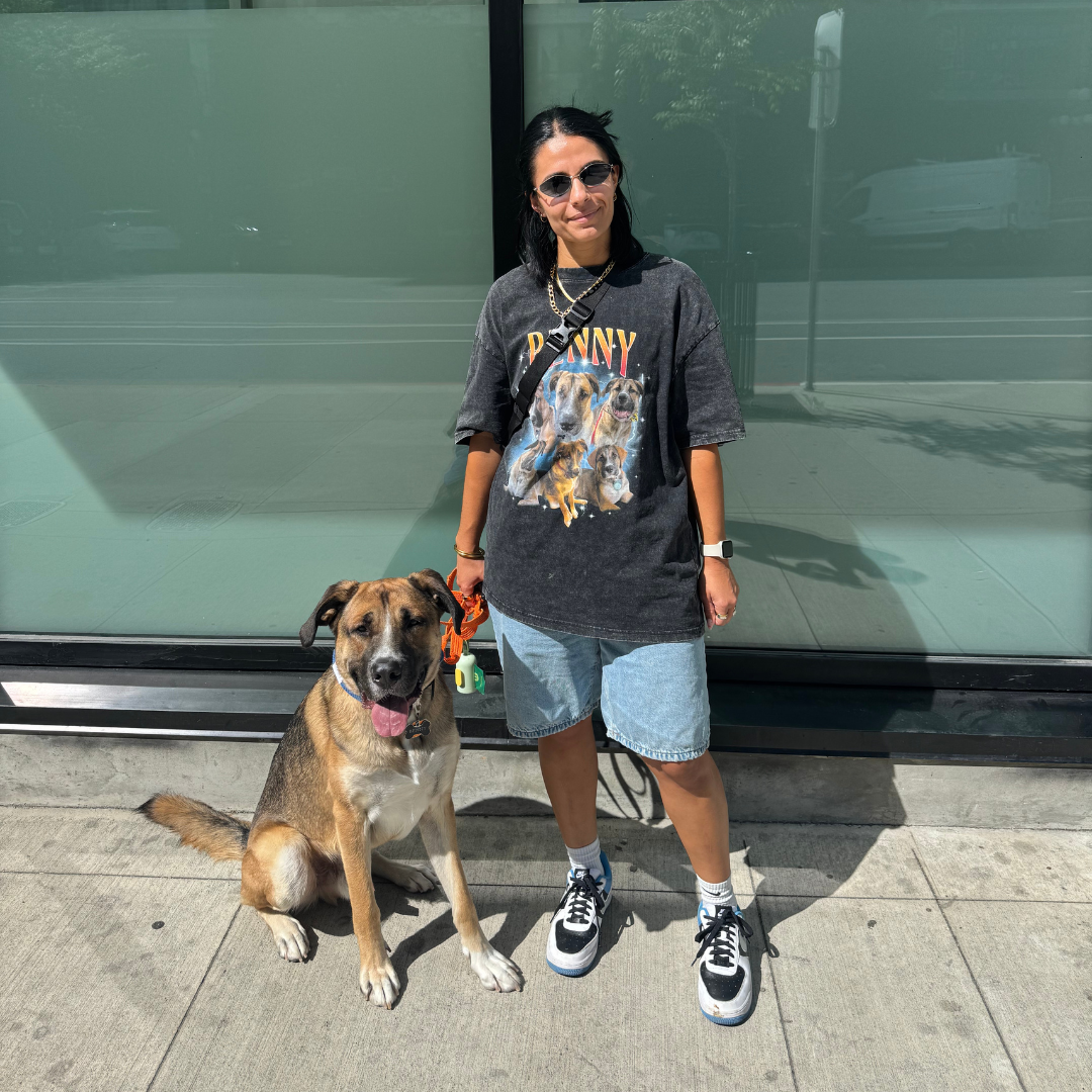 Olivia (Liv) Rahal with standing in front of a building with her dog