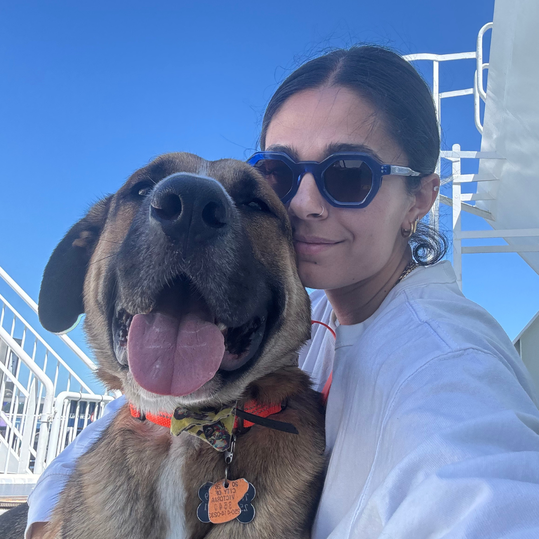 A close up of Olivia (Liv) Rahal and her dog snuggling outside